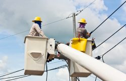 An,Electrical,Utility,Worker,In,A,Bucket,Fixes,A,Problem