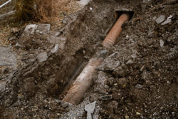 Old,Rusty,Pipe,For,Water,In,A,Trench,Open,For