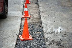 Repair,Pothole,In,Asphalt,Pavement,,Road,Work,Warning,Cones.,Roadwork,
